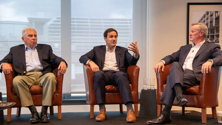 Photo of Teddy Bunzel, Admiral Bill McRaven, and John Abizaid discussing 